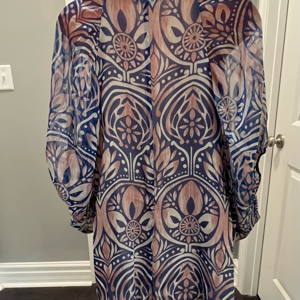 Super cute dress, fully lined, arms are a little sheer but not rest of dress